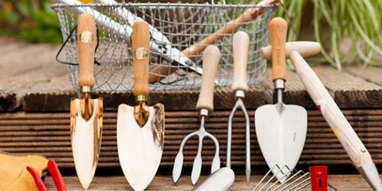 gardening tools on bench